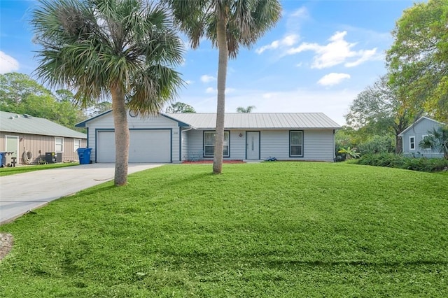 ranch-style house featuring a garage and a front yard