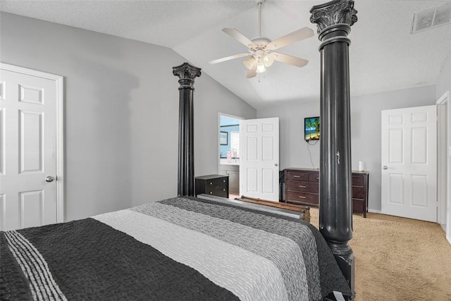 bedroom featuring vaulted ceiling, carpet, ceiling fan, and a textured ceiling