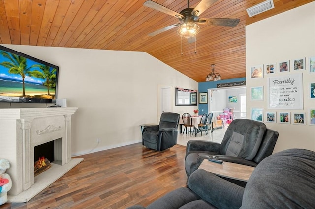 living room with hardwood / wood-style flooring, lofted ceiling, a premium fireplace, and wooden ceiling