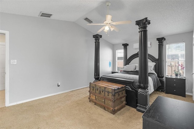 carpeted bedroom with ceiling fan, lofted ceiling, and a textured ceiling