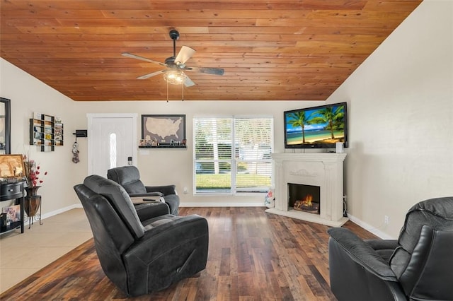 living room featuring hardwood / wood-style flooring, ceiling fan, lofted ceiling, and wooden ceiling