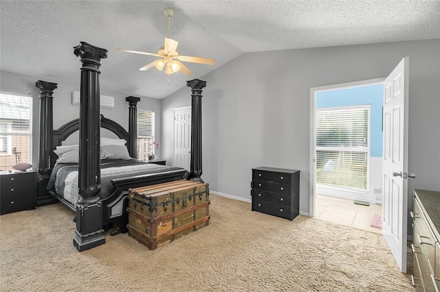 carpeted bedroom with multiple windows, lofted ceiling, and a textured ceiling