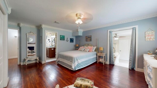 bedroom with dark hardwood / wood-style flooring, ornamental molding, and ceiling fan