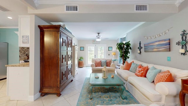 tiled living room with ceiling fan, french doors, and ornamental molding