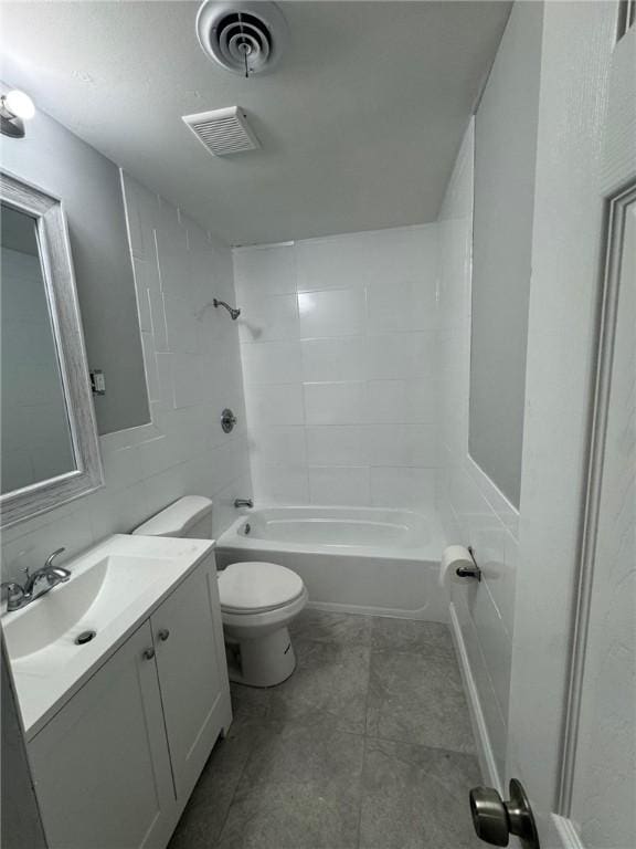 bathroom featuring vanity, toilet, washtub / shower combination, and visible vents