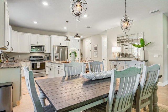 5151 Jasper Sq, Vero Beach, FL 32967 - dining area featuring recessed lighting and a chandelier