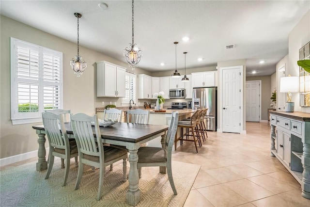 5151 Jasper Sq, Vero Beach, FL 32967 - dining area featuring recessed lighting, baseboards, and light tile patterned flooring