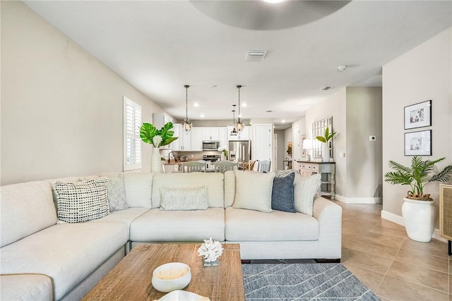 5151 Jasper Sq, Vero Beach, FL 32967 - living area featuring light tile patterned floors, baseboards, a ceiling fan, and recessed lighting