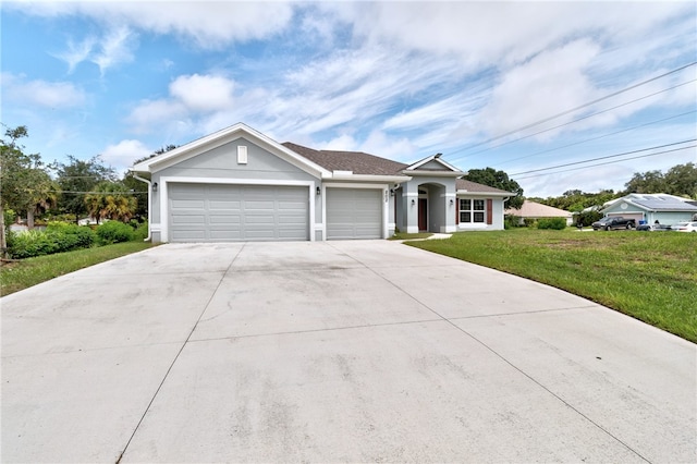 ranch-style home with a garage and a front lawn