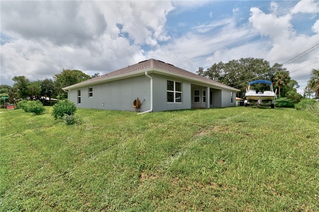 view of home's exterior featuring a yard