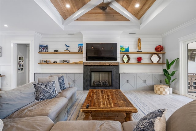 living room featuring ornamental molding, wood ceiling, light hardwood / wood-style floors, and a fireplace