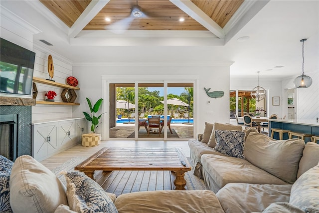 living room with hardwood / wood-style floors, beamed ceiling, and wood ceiling