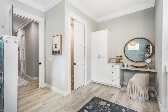 bathroom featuring hardwood / wood-style flooring and ornamental molding