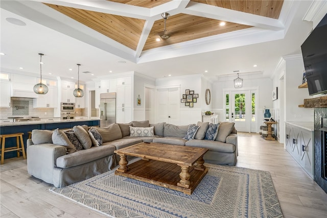 living room with wooden ceiling, light hardwood / wood-style floors, a raised ceiling, and crown molding