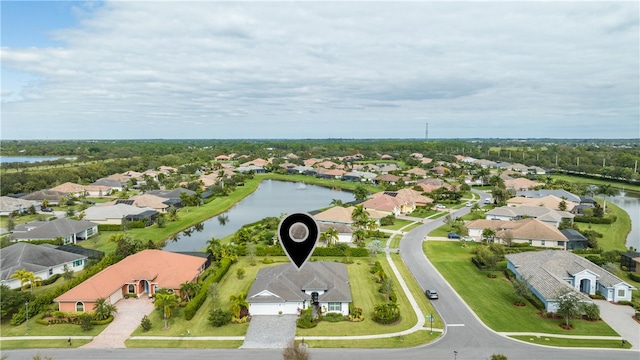 birds eye view of property featuring a water view