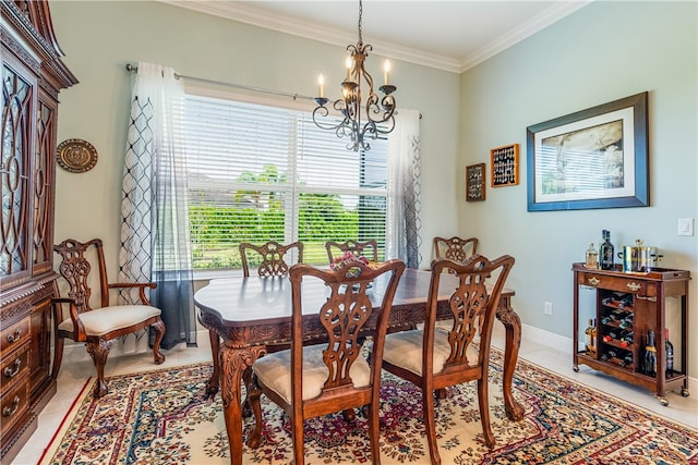 tiled dining area featuring crown molding and a chandelier