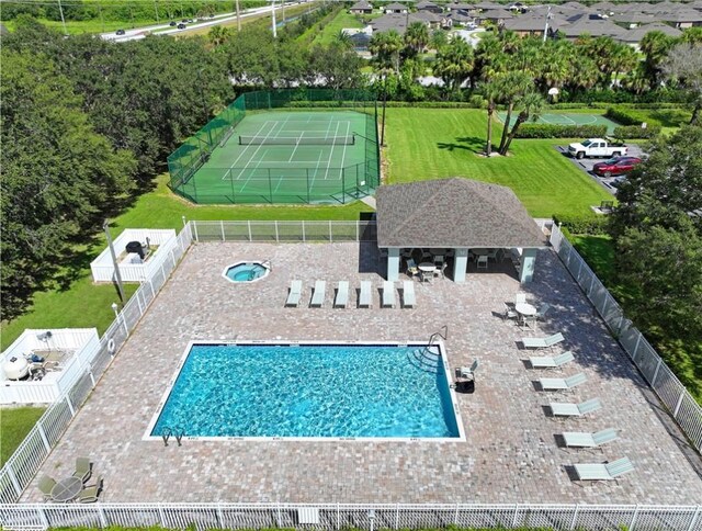 5765 W 1st Sq SW, Vero Beach, FL 32968 - community pool with a fenced backyard, a tennis court, and a patio area