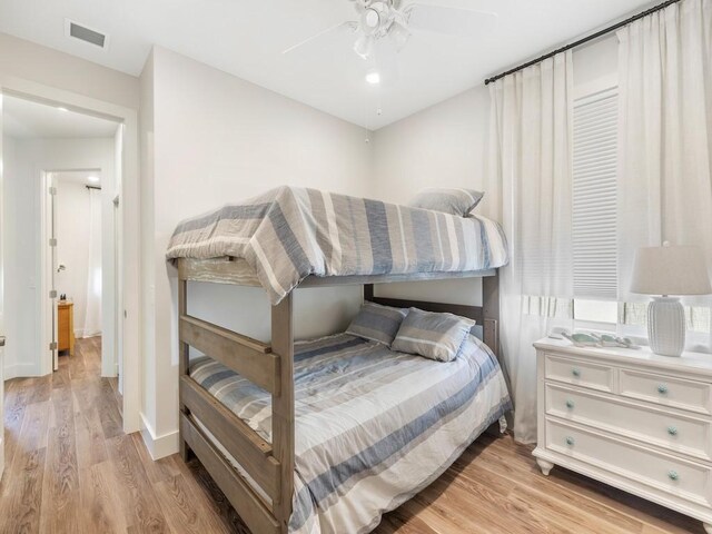 5765 W 1st Sq SW, Vero Beach, FL 32968 - bedroom with light wood-style floors and a ceiling fan