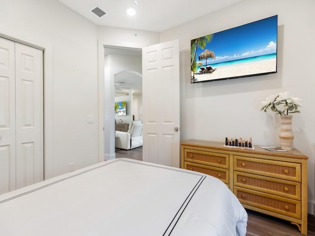 5765 W 1st Sq SW, Vero Beach, FL 32968 - bedroom with dark wood-type flooring and a closet