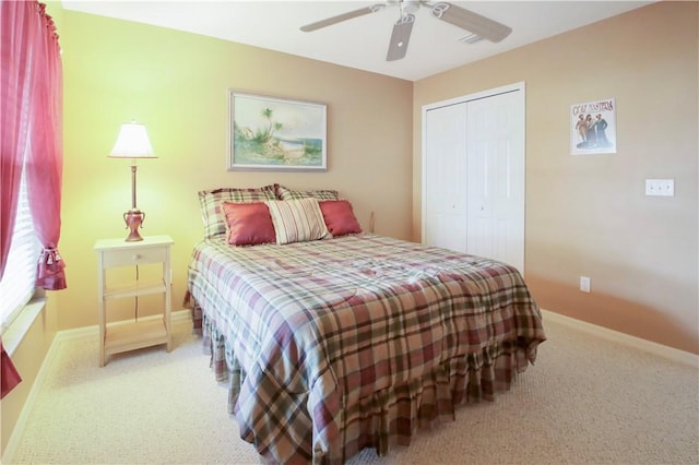 bedroom featuring carpet, ceiling fan, and a closet