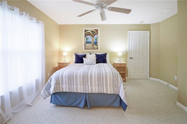 bedroom with multiple windows, carpet floors, and ceiling fan