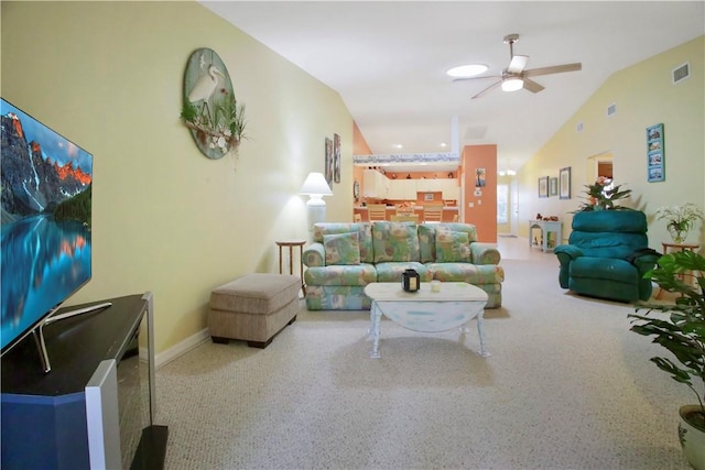 living room with ceiling fan and lofted ceiling