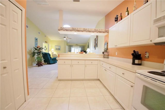 kitchen featuring kitchen peninsula, white appliances, vaulted ceiling, ceiling fan, and white cabinetry