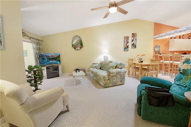 living room featuring carpet flooring, ceiling fan, and lofted ceiling