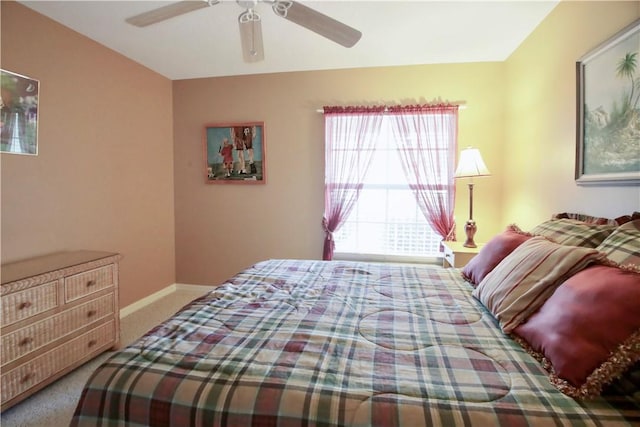 bedroom featuring ceiling fan and carpet floors