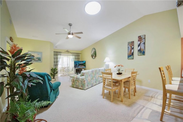 living room featuring ceiling fan, light colored carpet, and vaulted ceiling