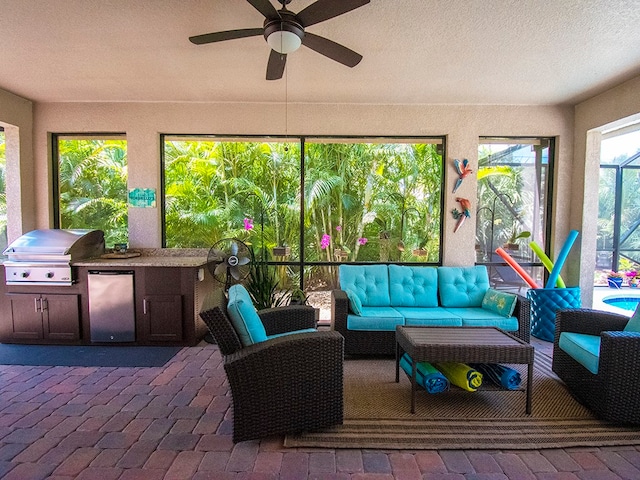 sunroom / solarium with ceiling fan