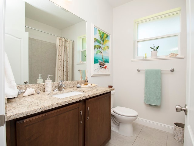 bathroom with vanity, tile patterned floors, toilet, and a shower with curtain