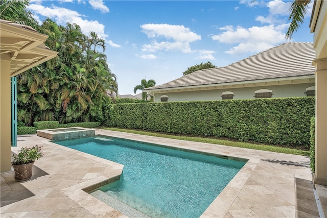 view of pool featuring an in ground hot tub and a patio area