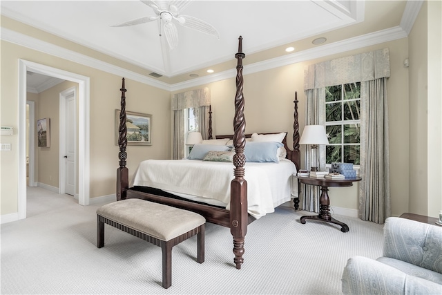 carpeted bedroom with ornamental molding and ceiling fan