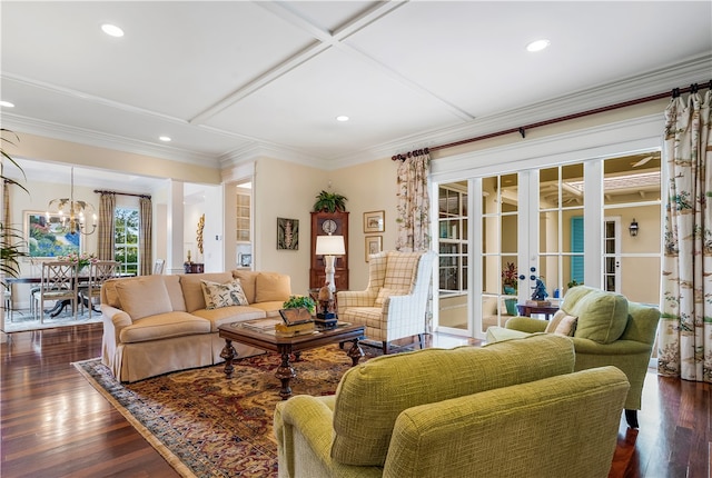 living room featuring a notable chandelier, dark hardwood / wood-style floors, crown molding, coffered ceiling, and french doors