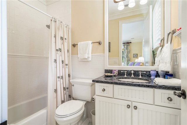 full bathroom with tile walls, crown molding, vanity, toilet, and shower / tub combo with curtain