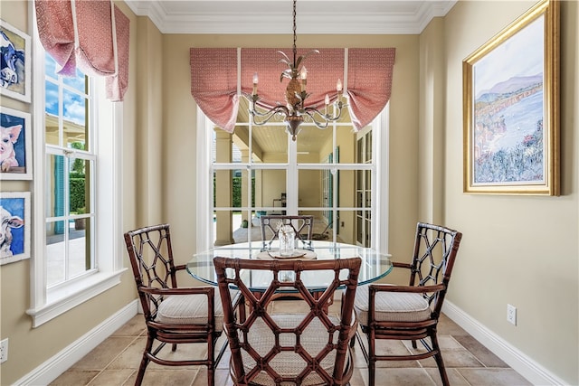 dining space featuring ornamental molding and an inviting chandelier