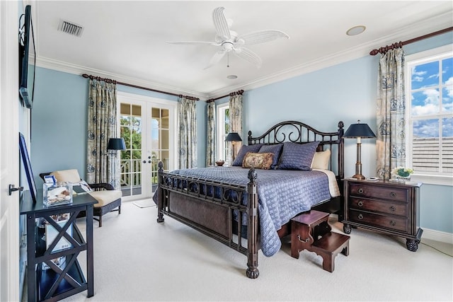 410 N Palm Island Cir, Vero Beach, FL 32963 - carpeted bedroom featuring access to exterior, french doors, crown molding, and ceiling fan