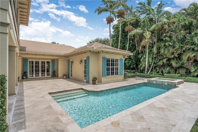 410 N Palm Island Cir, Vero Beach, FL 32963 - view of pool featuring french doors, a patio area, and a pool with connected hot tub