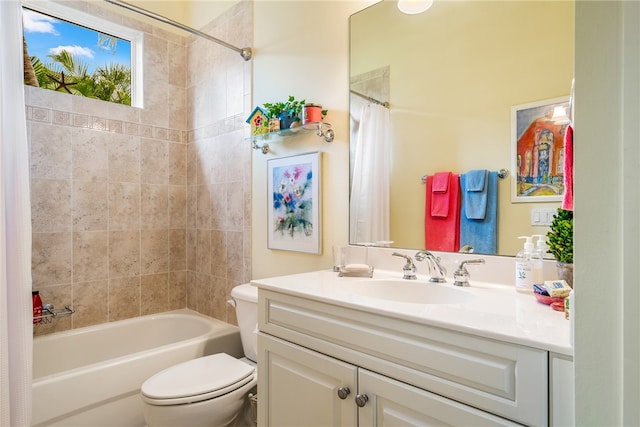 full bathroom with vanity, shower / bath combo with shower curtain, and toilet