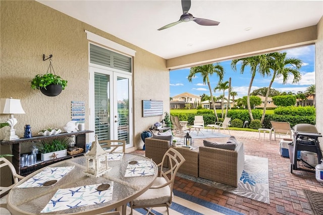 view of patio featuring ceiling fan and french doors