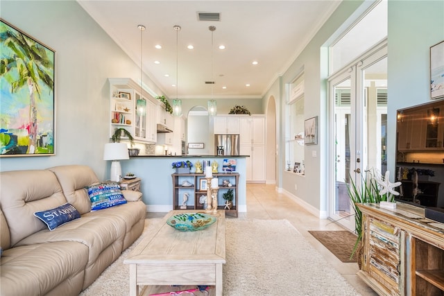 tiled living room with ornamental molding