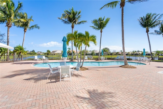 view of swimming pool with a patio area