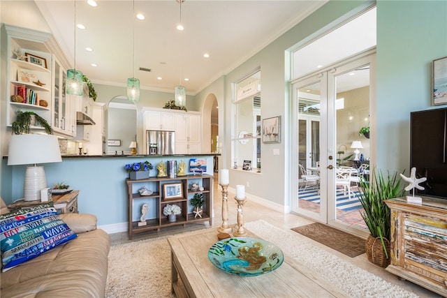 living room featuring ornamental molding and french doors