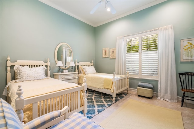 tiled bedroom with ornamental molding and ceiling fan