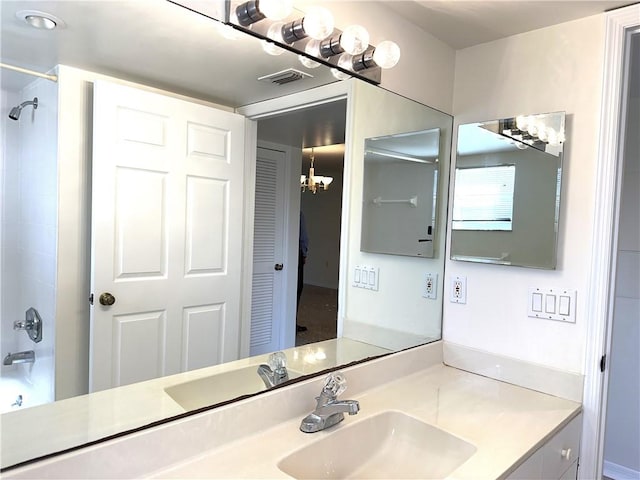 bathroom with vanity and washtub / shower combination