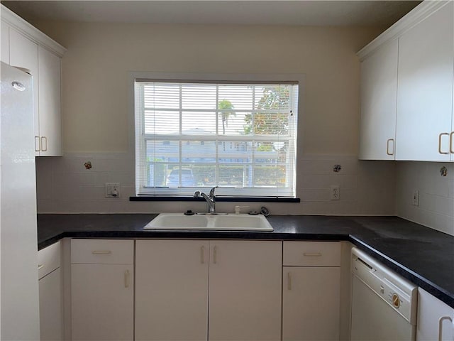 kitchen featuring white cabinetry and sink