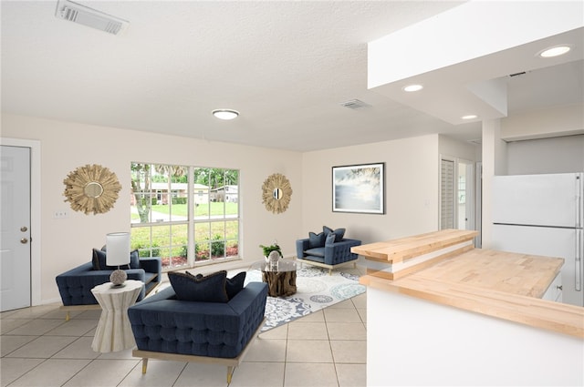 2313 2nd St SW, Vero Beach, FL 32962 - living area with light tile patterned floors and recessed lighting