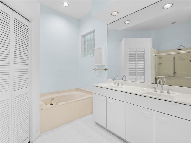 bathroom featuring tile patterned floors, vanity, and independent shower and bath