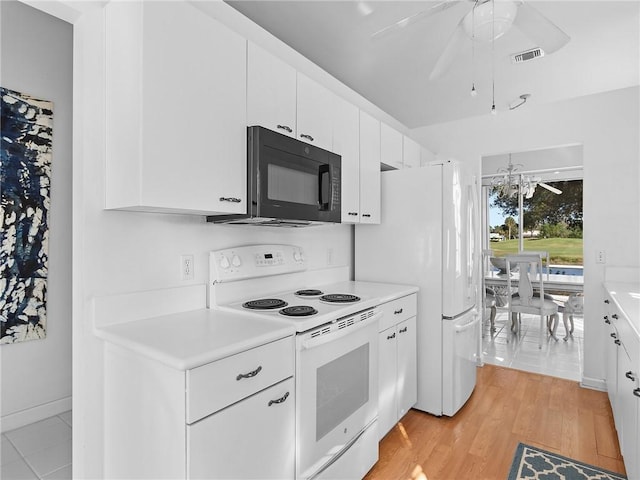 kitchen with ceiling fan with notable chandelier, white appliances, light hardwood / wood-style flooring, and white cabinetry